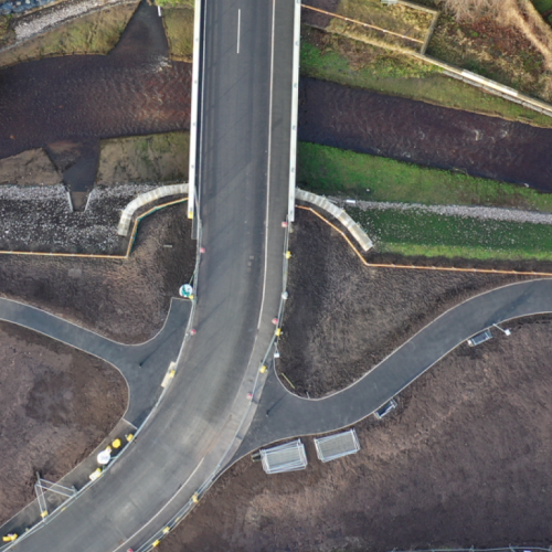 Birdseye view of the new road built over a river.