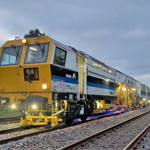 Matisa tamper tamping the railway tracks