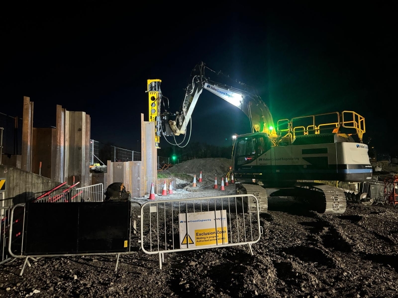 Piling machine on construction site at night