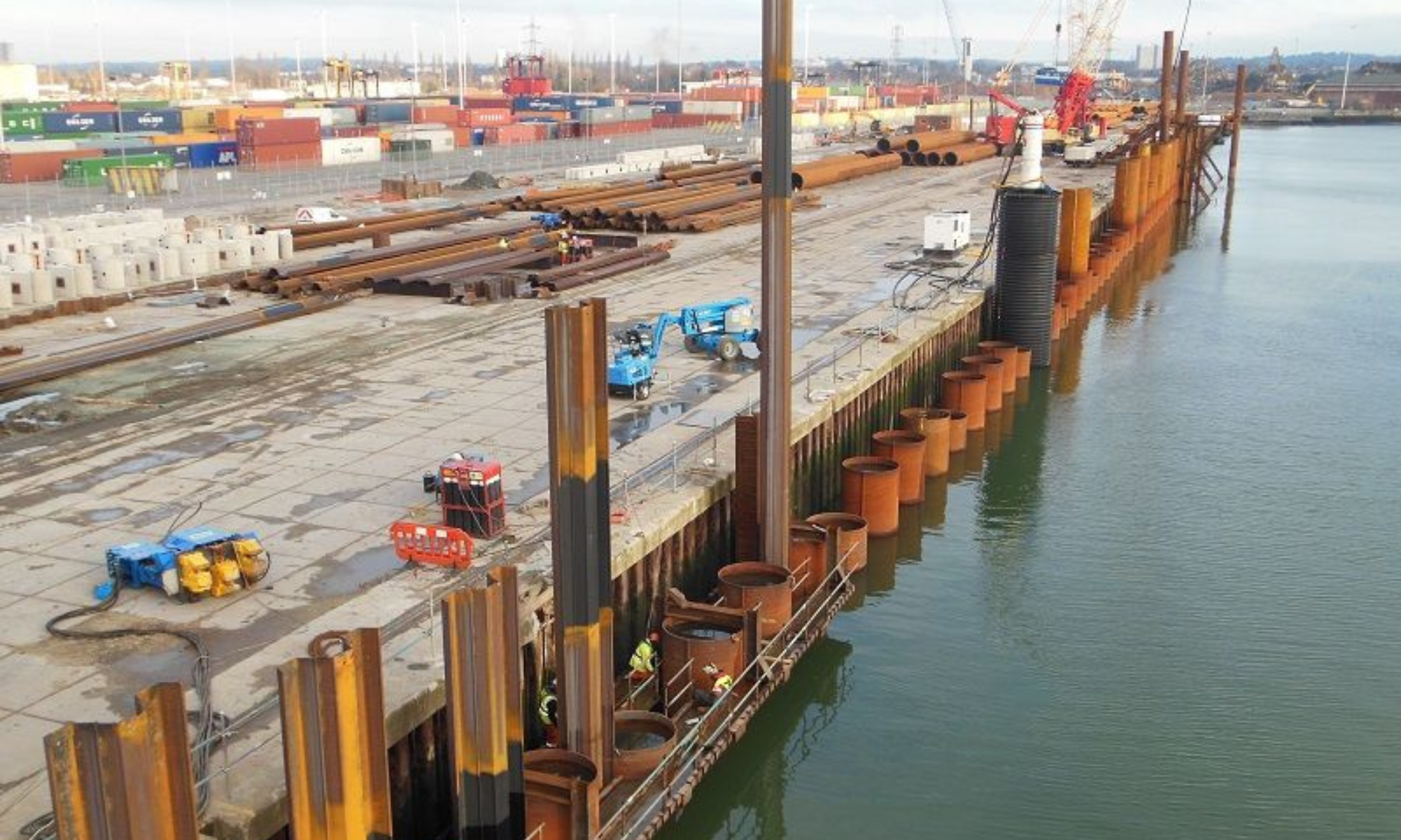 Piling rig on the water edge, piling into the sea