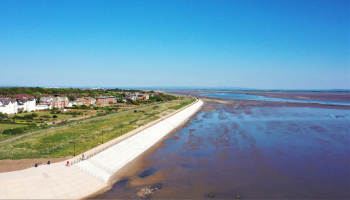 Coastal wall and footpath on a sunny day