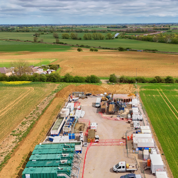 Aerial shot showing drilling area, and fields beyond